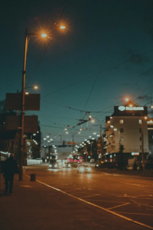 a city street with traffic and the night