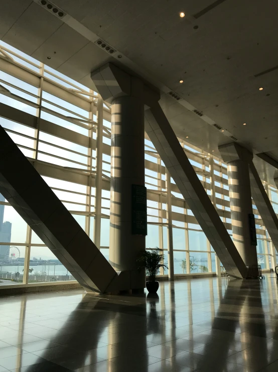 a plant is in a large lobby of a building