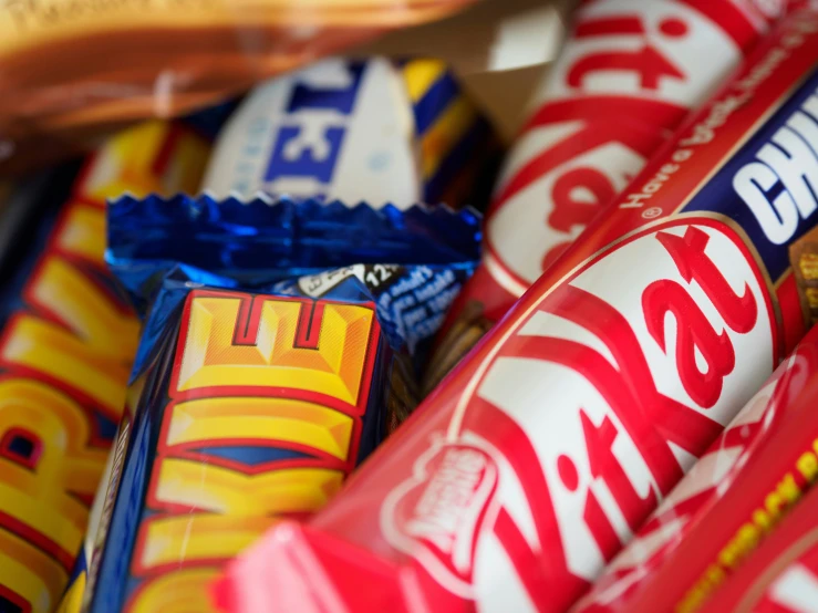 a variety of candy bars are on display