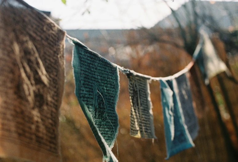 there are several pieces of clothing hung on the clothesline