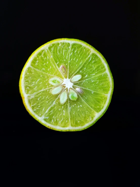 a lime is cut in half with leaves