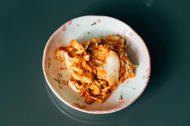 an empty white bowl with some pasta in it