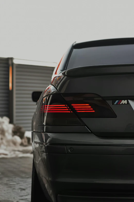 a black car parked in front of a building