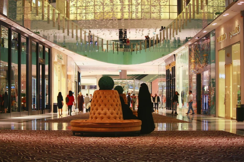 a shopping mall with large balconies and a colorful couch