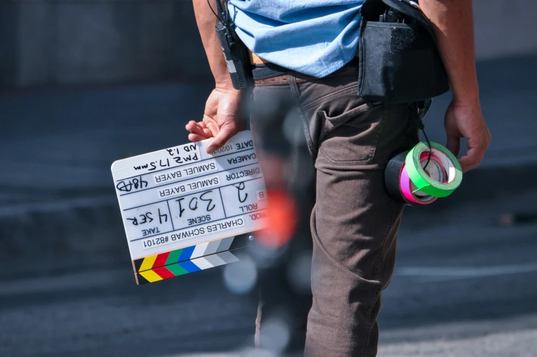 a close up of a person holding a sign