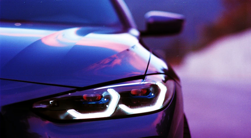 a close up image of a bmw car head light