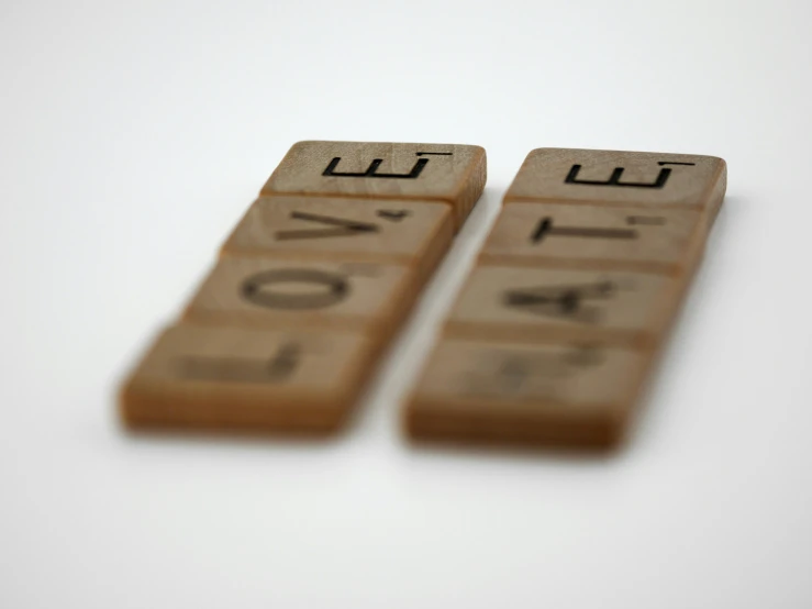 two wooden words in the shape of letters written in a typewriter