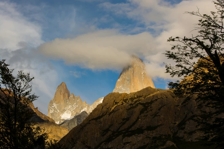 a mountain with very tall and very steep peaks in the background