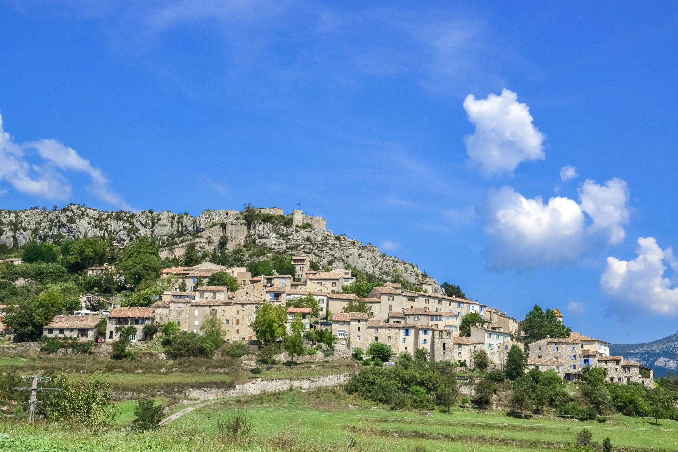 an image of some very pretty buildings on the hill