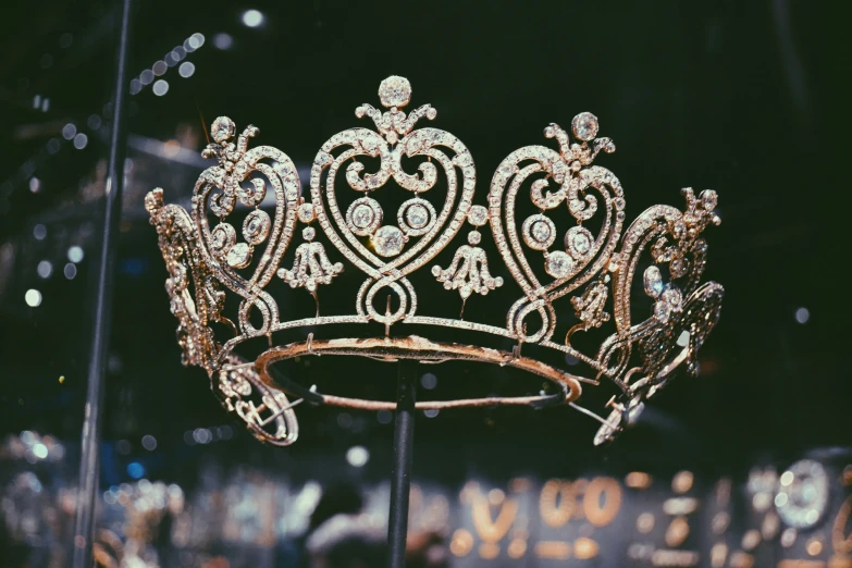 a golden tiara with diamond decorations on display