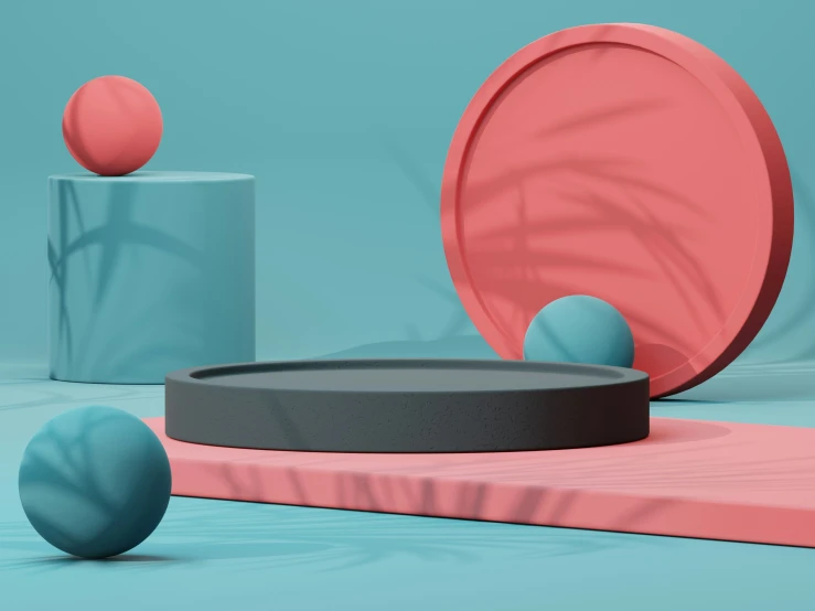 a pink round object near three blue balls