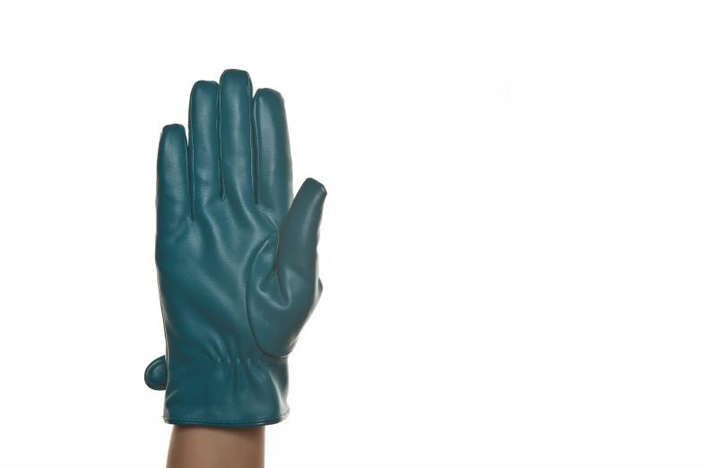 a woman's blue leather glove against a white background