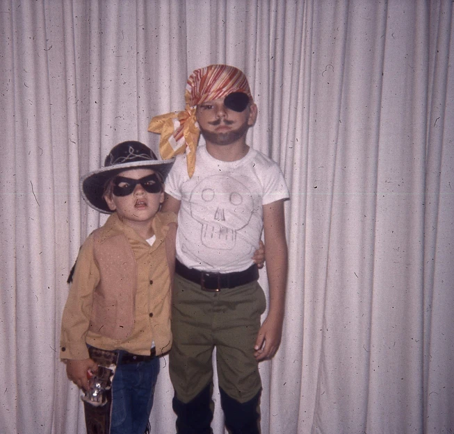 an old po of two boys dressed as cowboy and cowgirl