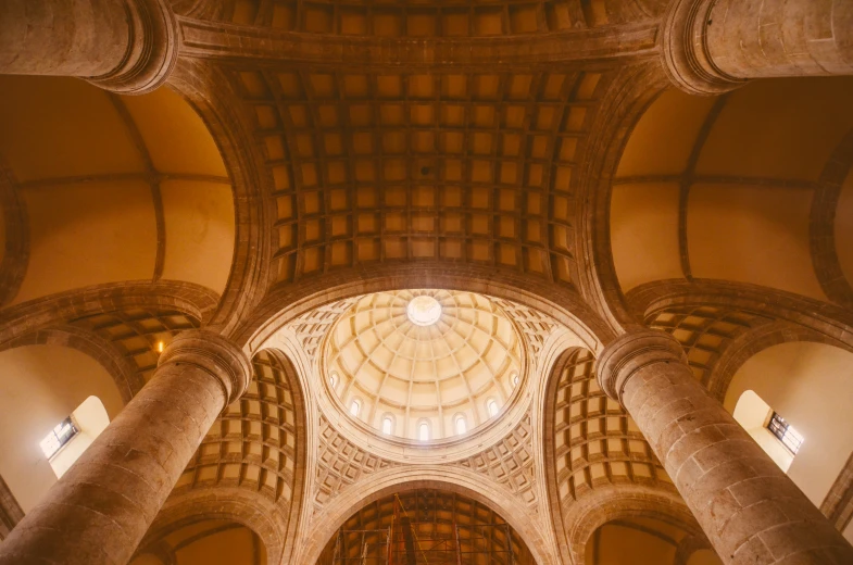 the inside view of an ornate cathedral and a very tall ceiling