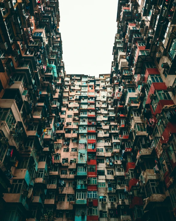 a very tall building with many windows and shutters