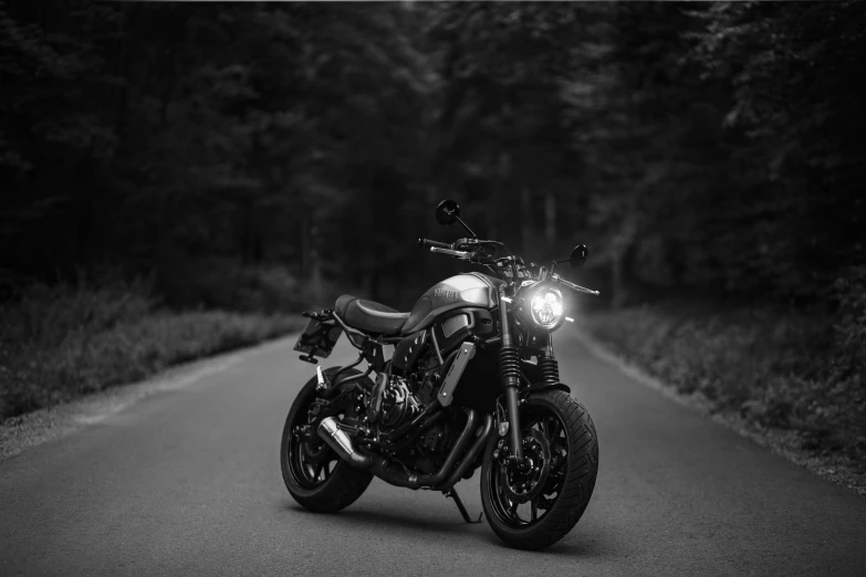 a black and white image of a motorcycle