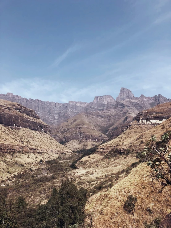 a view of the mountains from above near a road