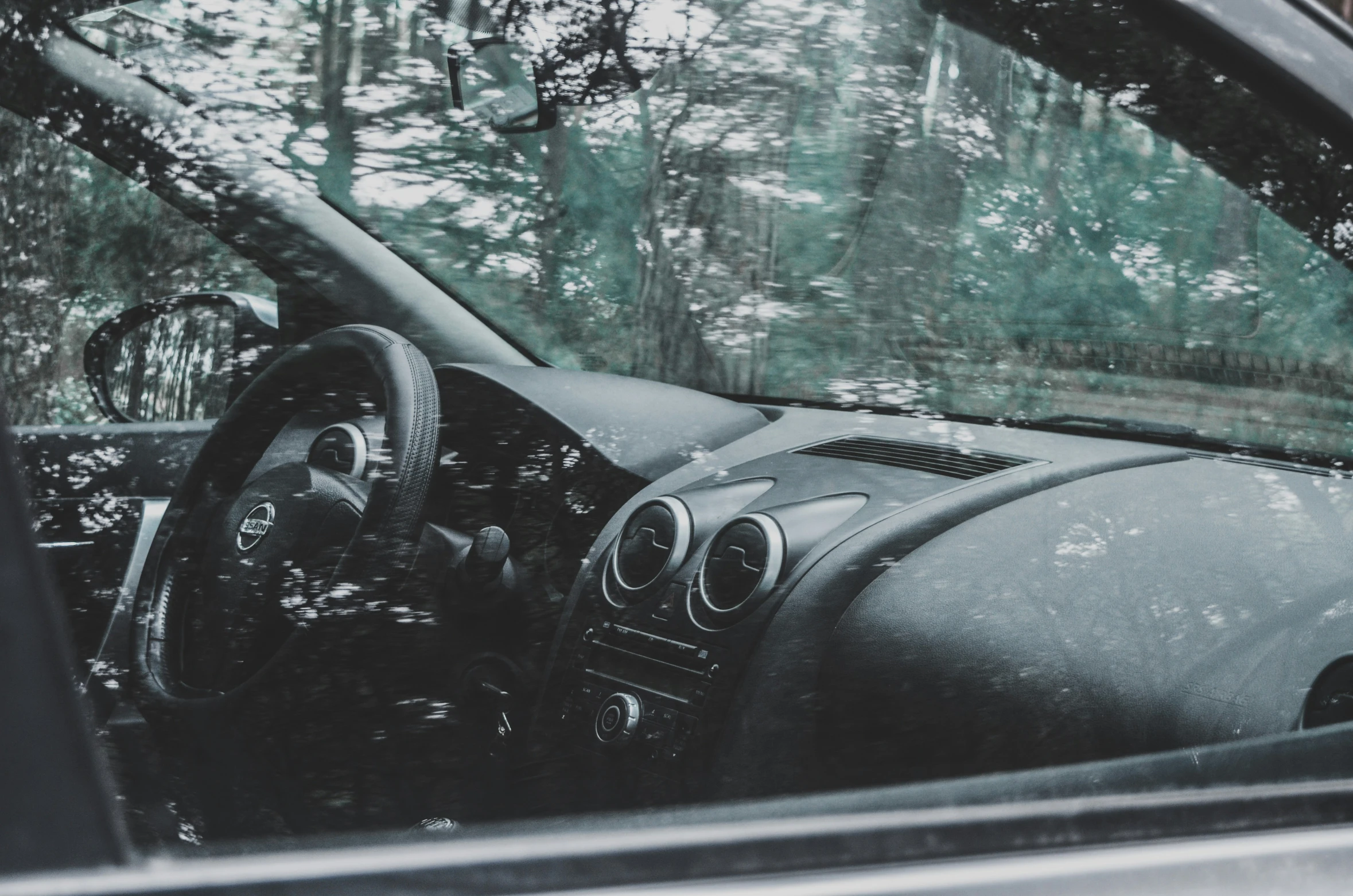 the dashboard inside of a car with steering wheel