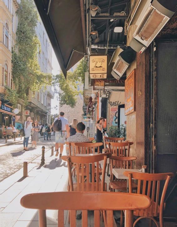 the corner tables and chairs in the sidewalk cafe