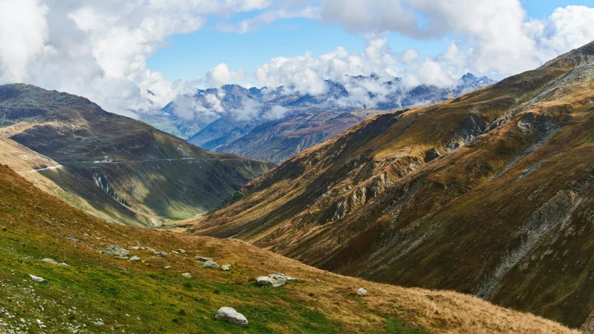 some mountains and grass near each other