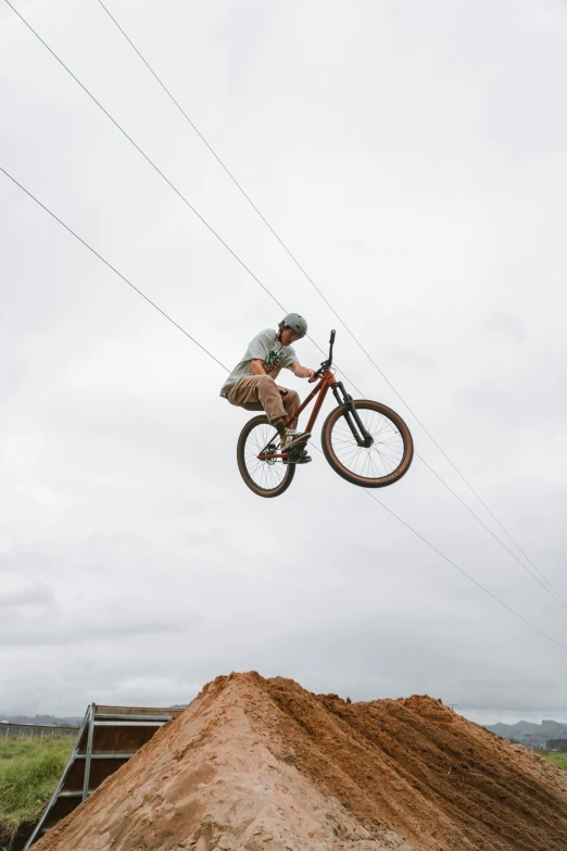 a man flying through the air on top of a bicycle