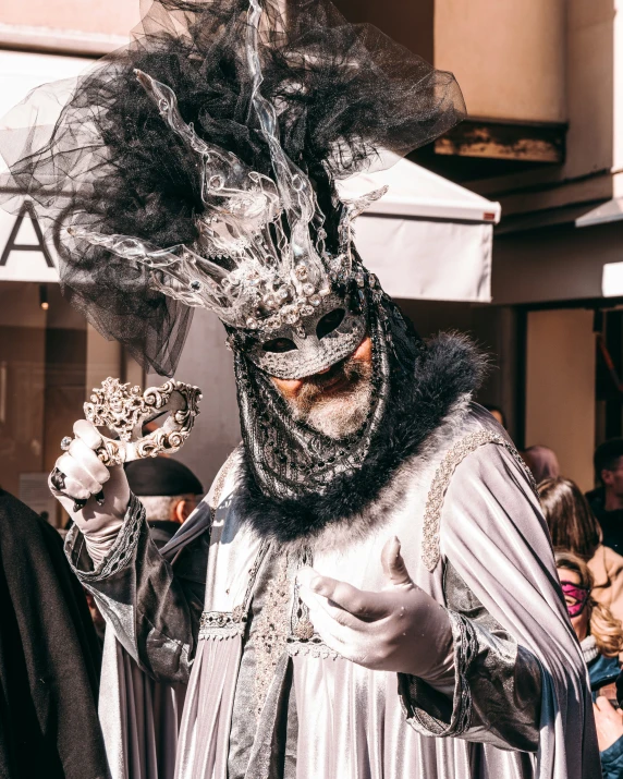 a man wearing a costume with horns and headpieces