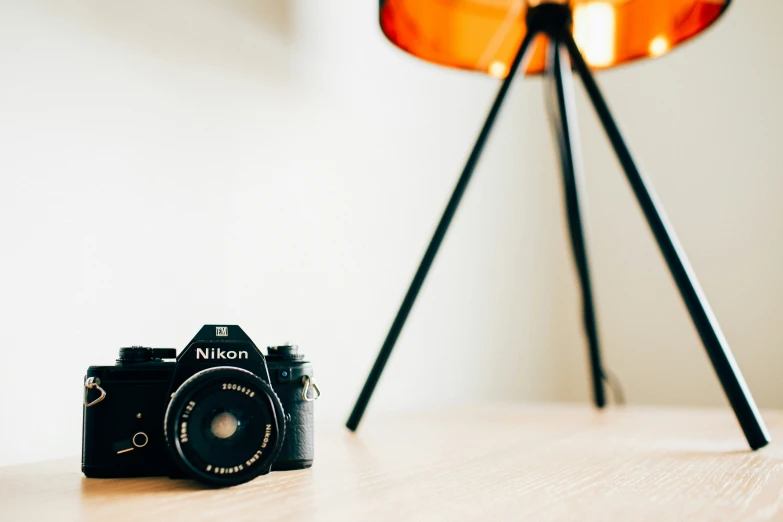 a pograph of an old camera sitting on a table