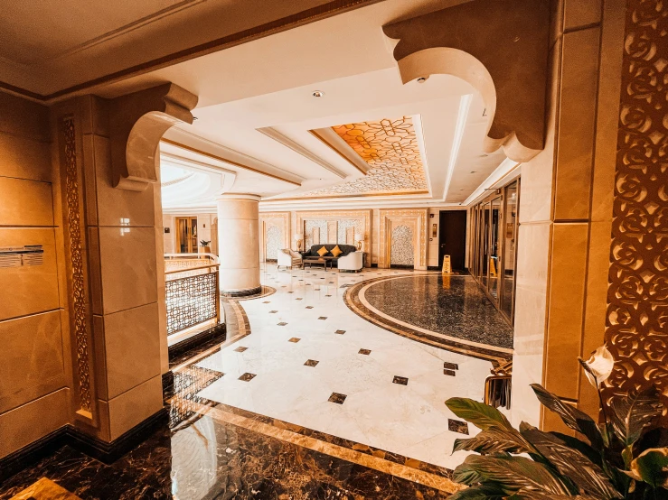 the inside of a lobby with marble floors