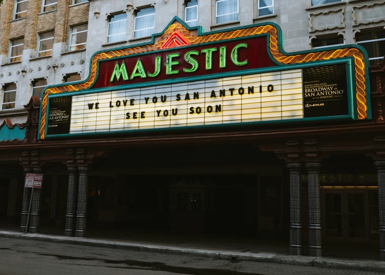 the marquee sign for majestic theatre on the corner of city street