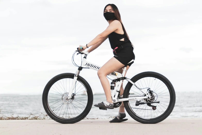 a person in black clothes on a bike