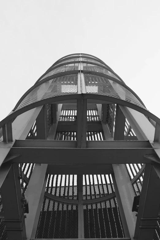 the back side of a tall structure against a blue sky