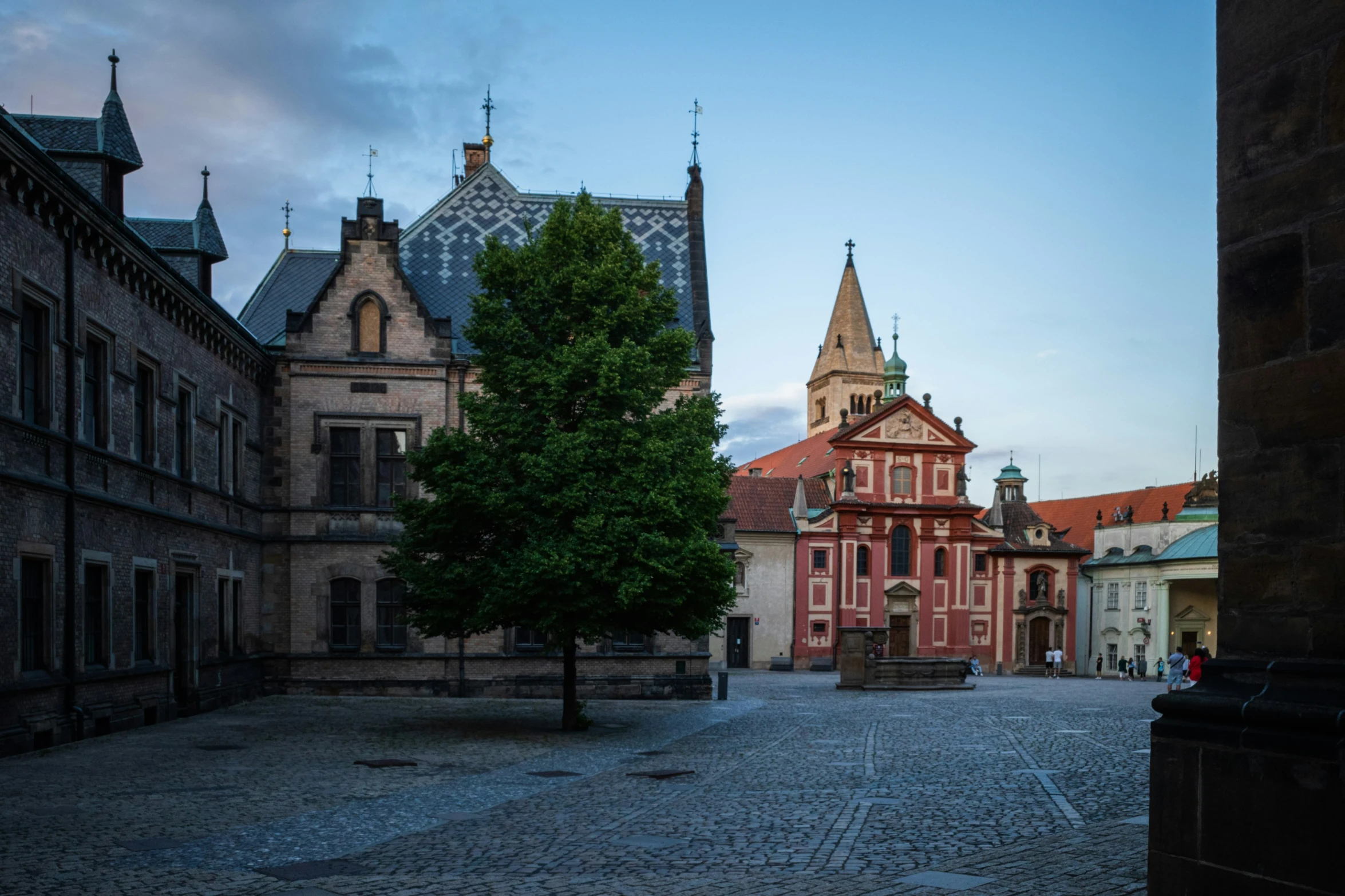 a street view looking at an old building in the distance