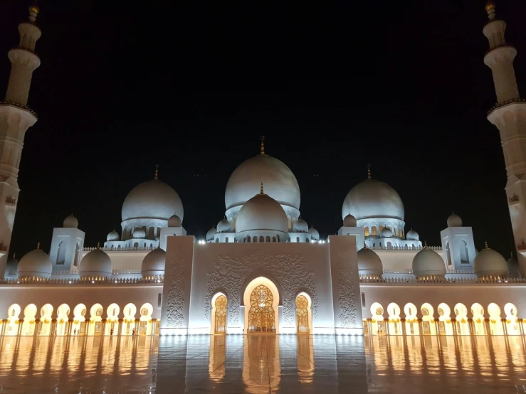 an image of night scene in front of mosque