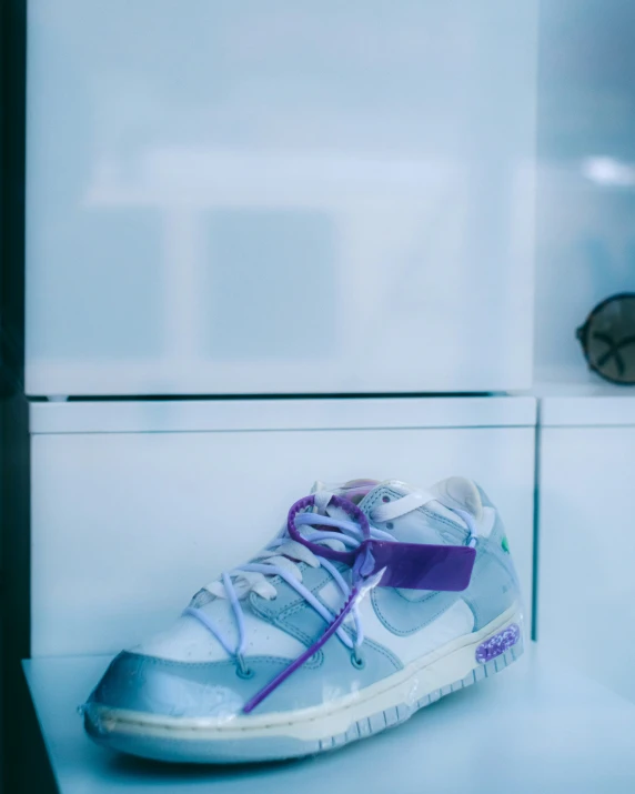 a pair of shoes on display on top of a table