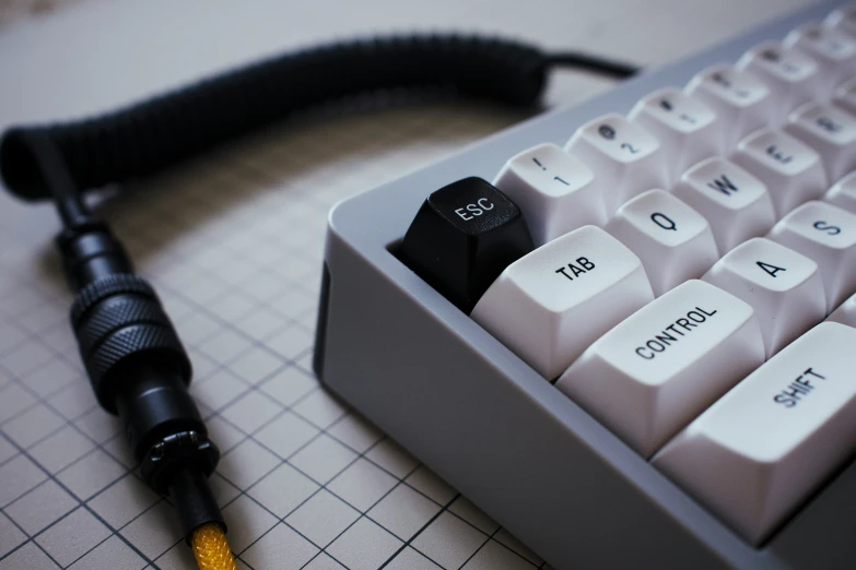 keyboard, microphone and black and white keys on a table