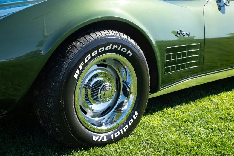 this green sports car has some very interesting rims