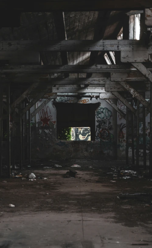 a very dark room with graffiti all over it