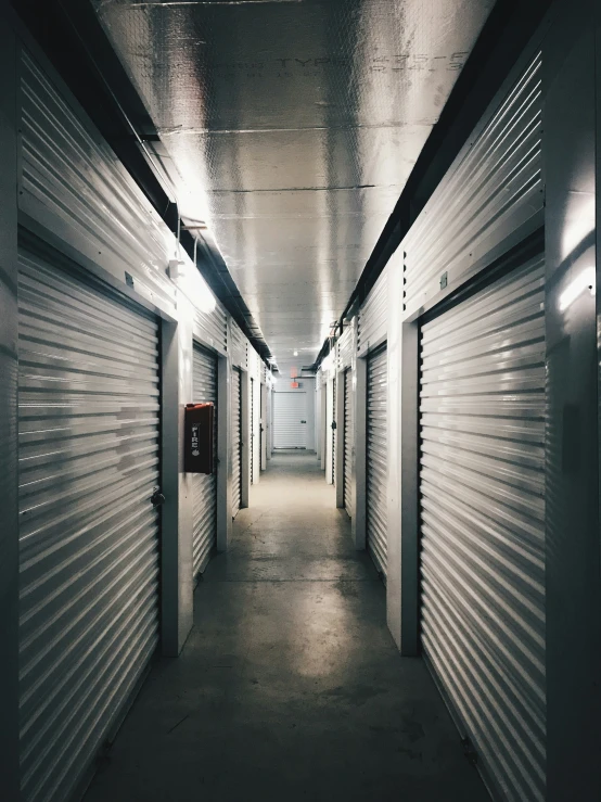 some storage units are empty in a long hallway