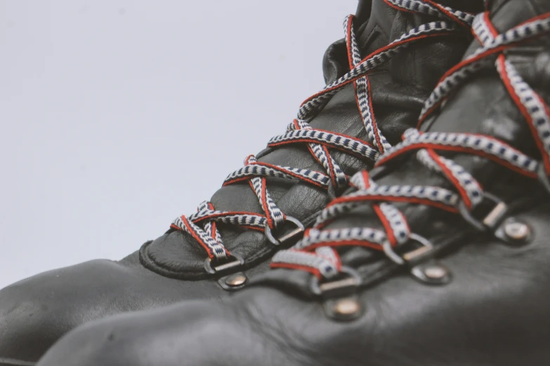 the laces on the boot are visible and red