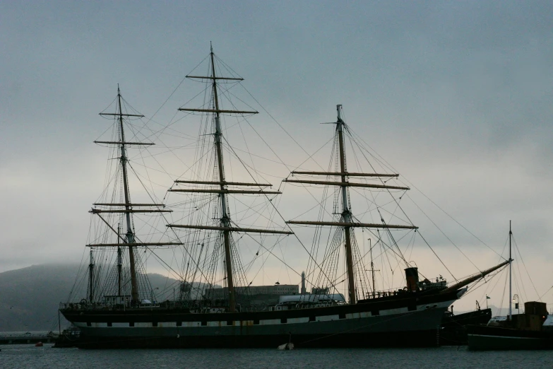 an old boat is docked near another old boat