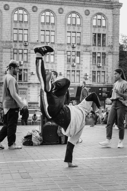 a group of people standing around on the street