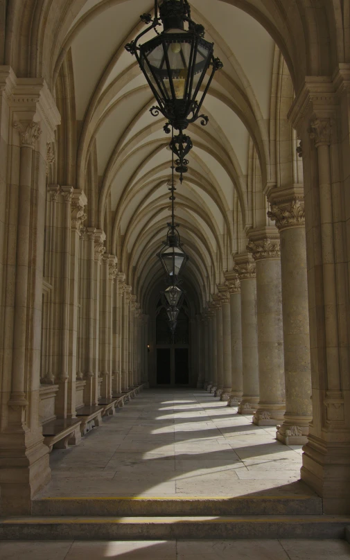 an open walkway between columns and lights