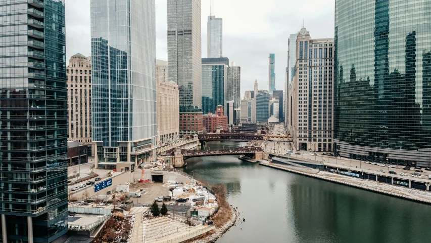 a city with very tall buildings is shown on a cloudy day