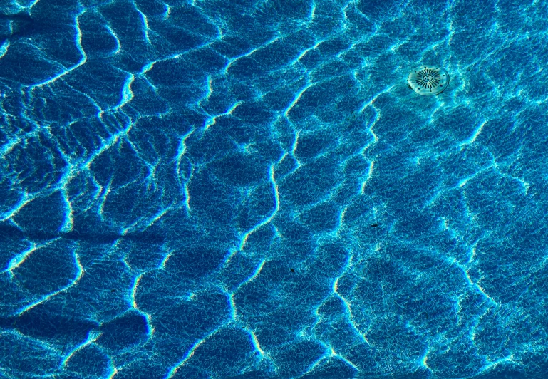 a person floating on a jet ski in a pool