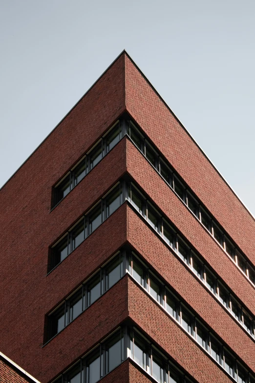 a tall brick building sitting next to a stop light