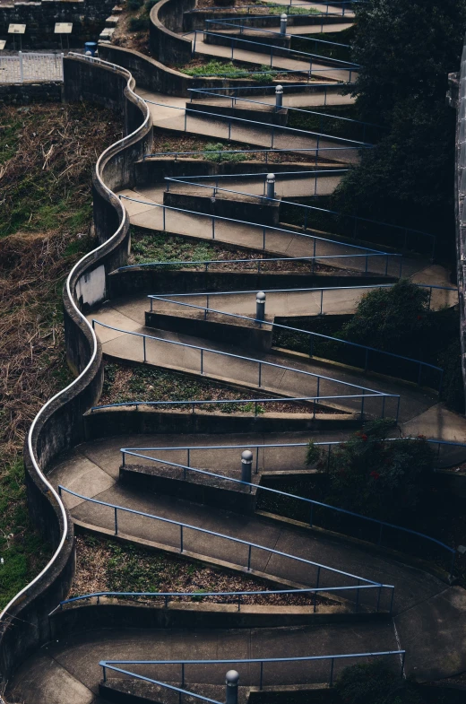 several staircases with blue hand rails on each one