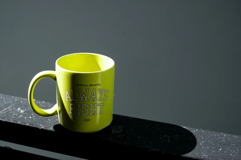 a yellow coffee mug is on top of the counter