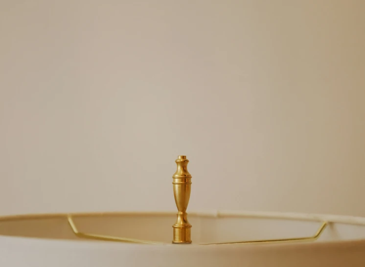 an ornate candle in the center of a cake plate