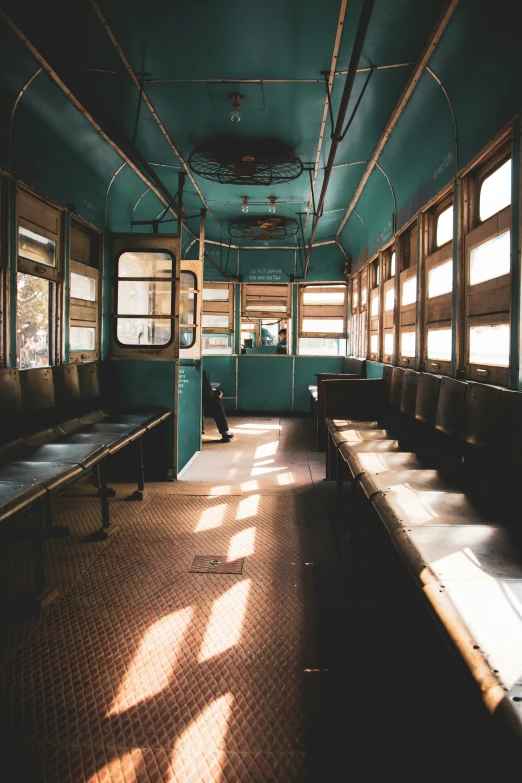 the inside of a train car with long benches