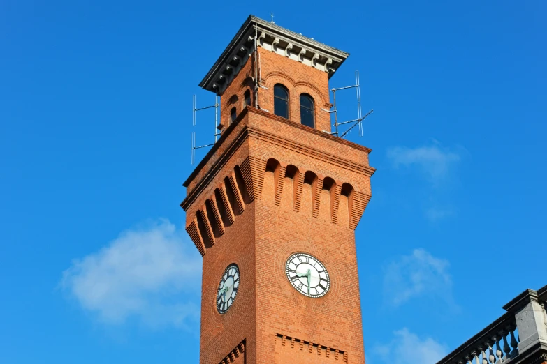 there is a tall tower that has a clock on it